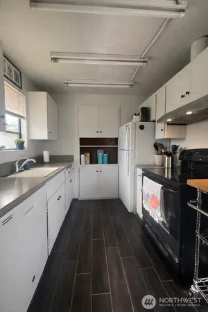 a kitchen with a stove and a refrigerator