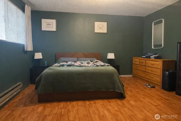 a bedroom with a bed and window