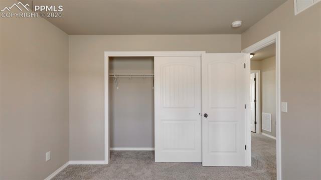 2316 Rusty Ridge Court Colorado Springs, CO 80921 - Photo 29 of 46 Upstairs Bedroom 1