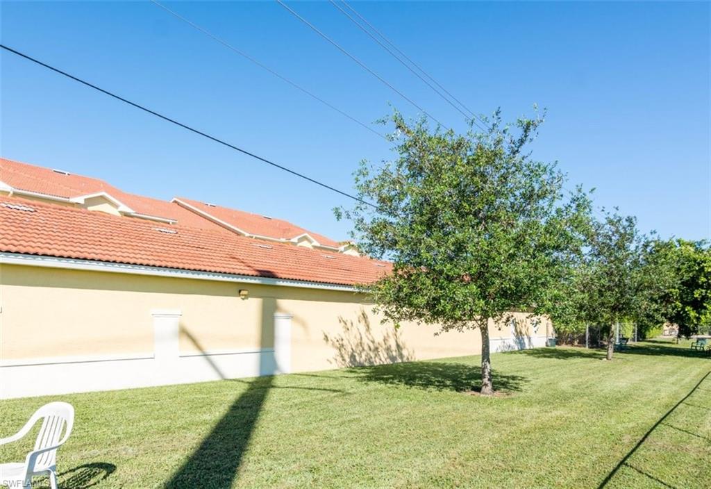 4635 St Croix Lane, Unit 1218 Naples, FL 34109 - Photo 39 of 40 View of grassy yard
