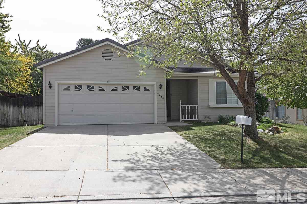 4652 Goodwin Road Sparks, NV 89436 - Photo 1 of 20 a front view of a house with a yard and garage