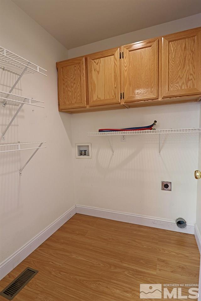 4652 Goodwin Road Sparks, NV 89436 - Photo 11 of 20 a view of a room with wooden floor and cabinet