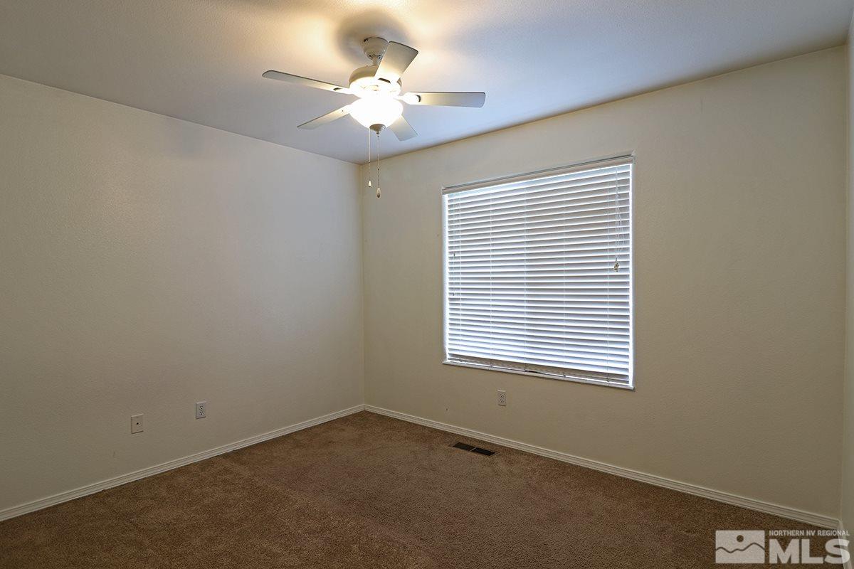 4652 Goodwin Road Sparks, NV 89436 - Photo 12 of 20 an empty room with a window
