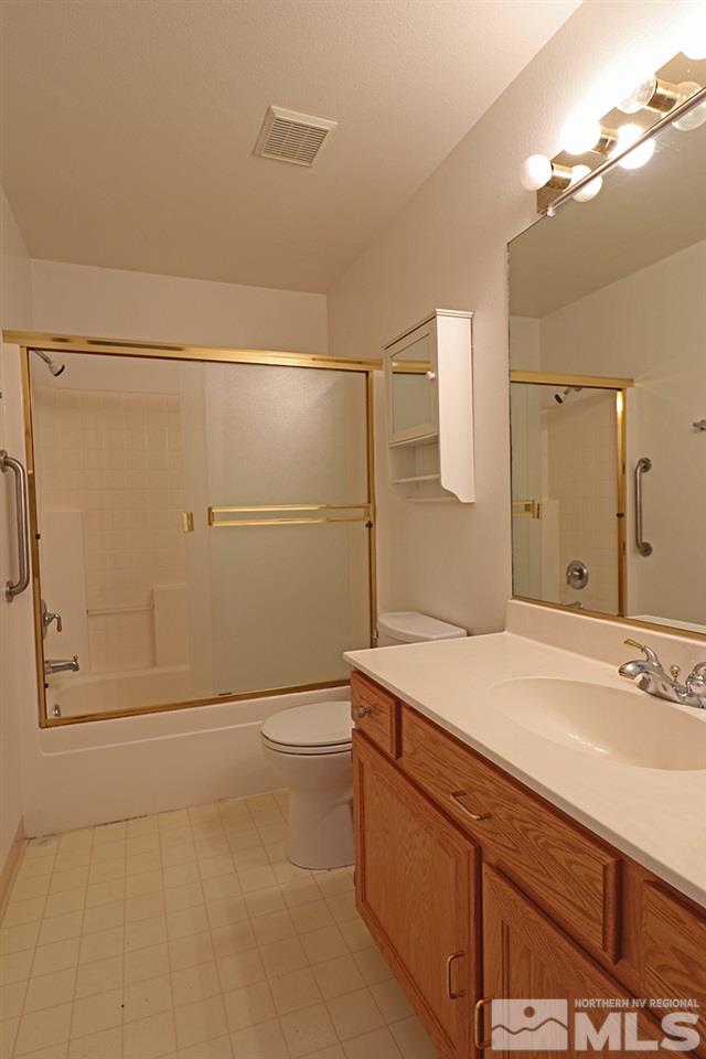 4652 Goodwin Road Sparks, NV 89436 - Photo 13 of 20 a bathroom with a sink and a mirror
