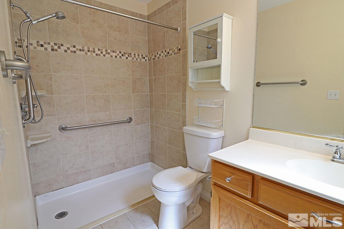 4652 Goodwin Road Sparks, NV 89436 - Photo 15 of 20 a bathroom with a sink toilet and shower