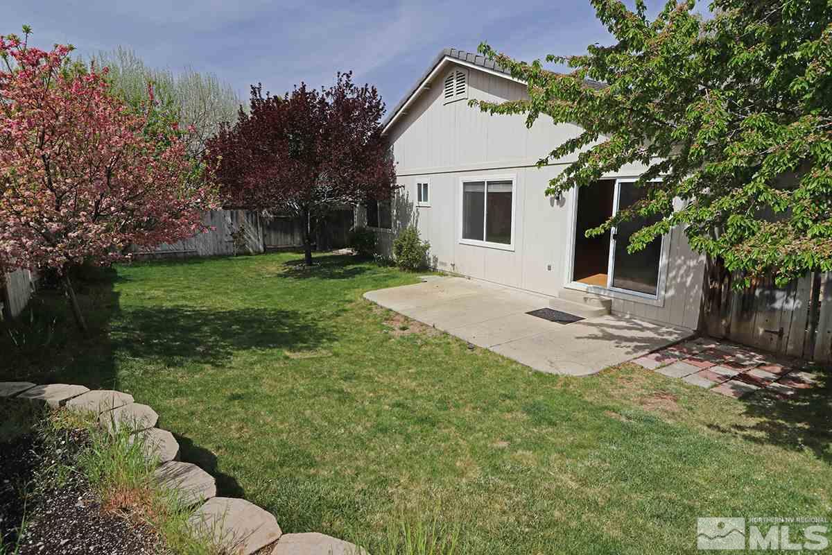 4652 Goodwin Road Sparks, NV 89436 - Photo 17 of 20 a view of backyard of house with outdoor seating