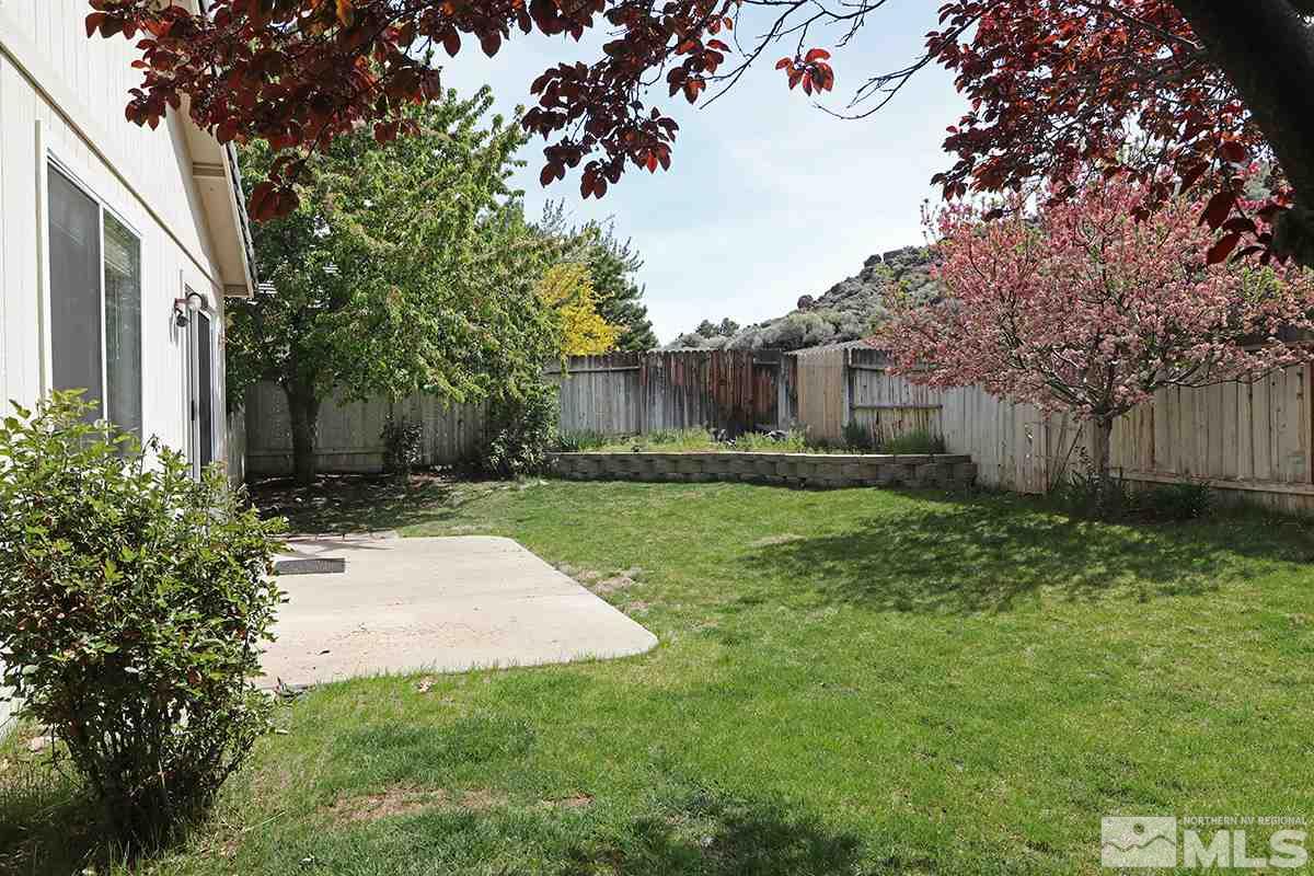 4652 Goodwin Road Sparks, NV 89436 - Photo 20 of 20 a backyard of a house with lots of green space