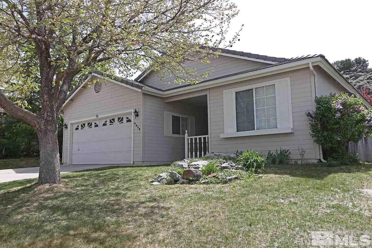 4652 Goodwin Road Sparks, NV 89436 - Photo 2 of 20 a front view of a house with garden