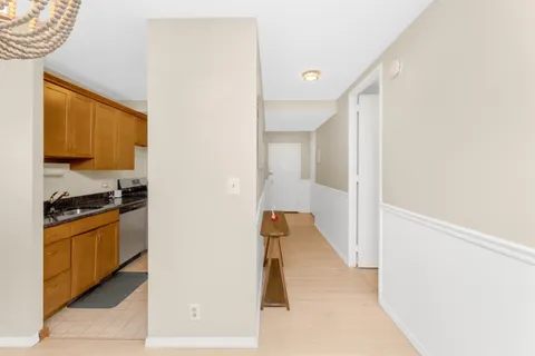 a view of a kitchen from the hallway