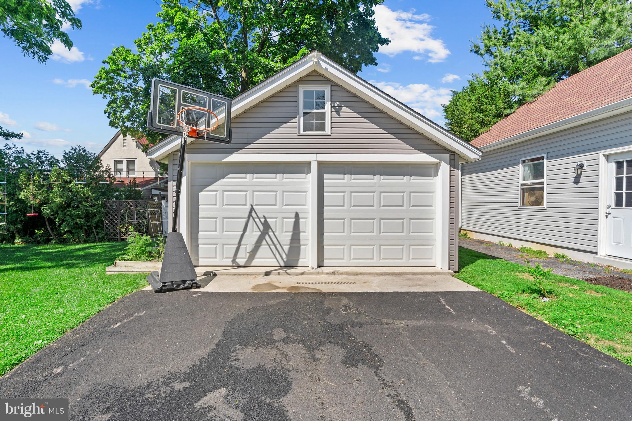 1118 Allston Road Havertown, PA 19083 - Photo 8 of 58 a front view of a house with a yard and garage