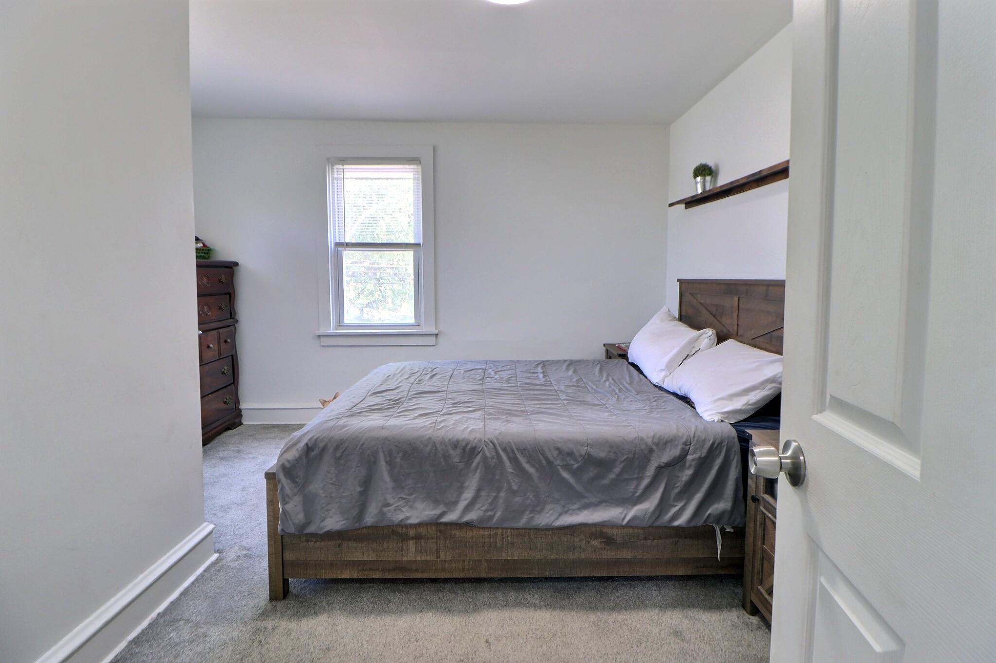 1022 Penn Line Road Paulsboro, NJ 08066 - Photo 15 of 19 a bedroom with a bed and a window