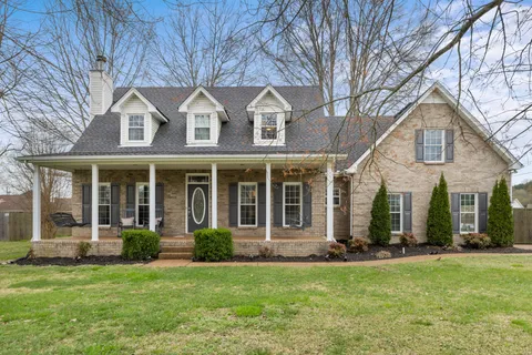 front view of a house with a yard