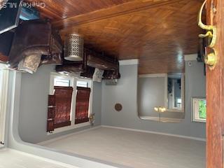 62-53 80th Road Queens, NY 11385 - Photo 7 of 11 Living room with arched walkways, healthy amount of natural light, and ornamental molding