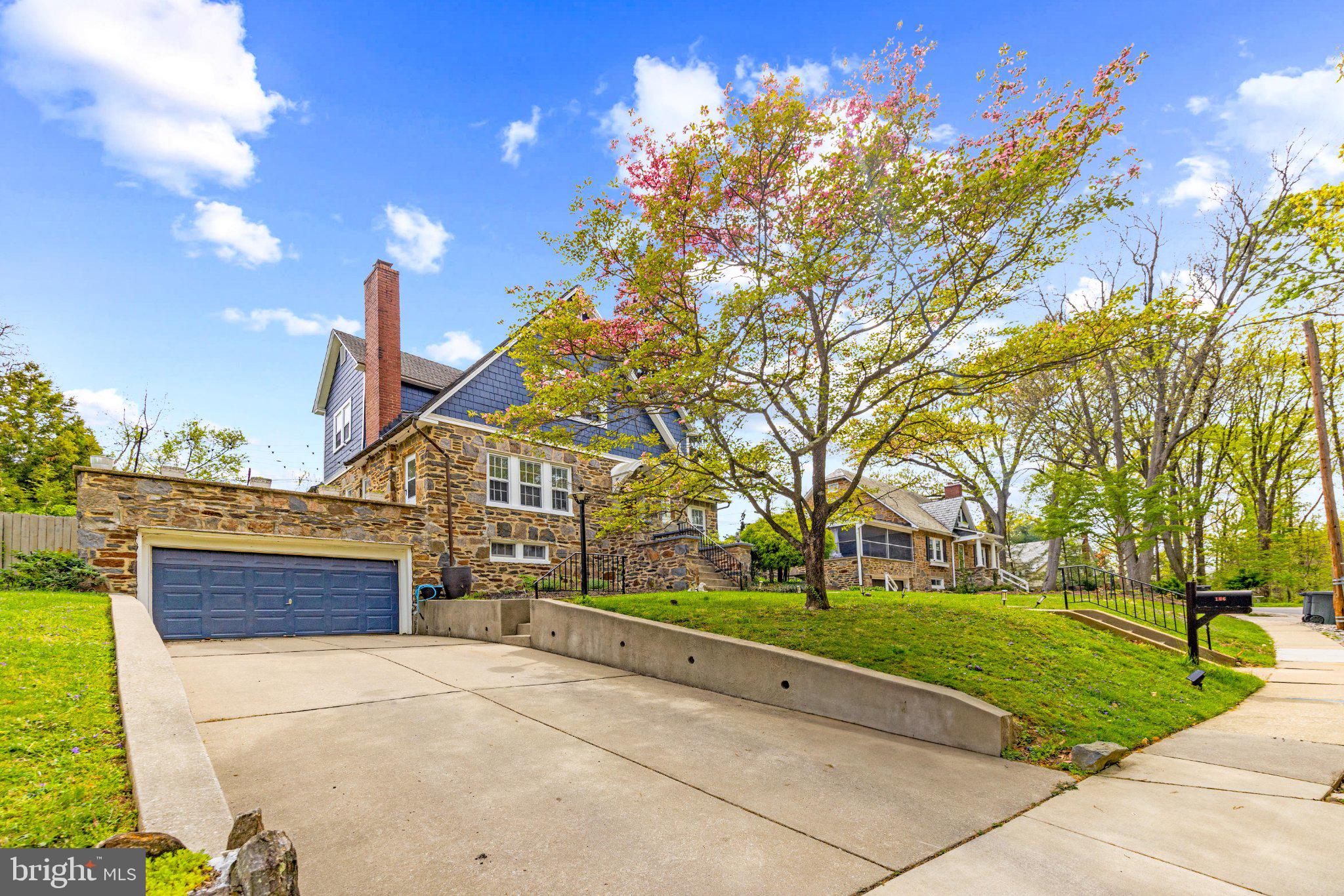 106 Edgewood Road Baltimore, MD 21286 - Photo 4 of 42 Charming stone home with lush greenery.