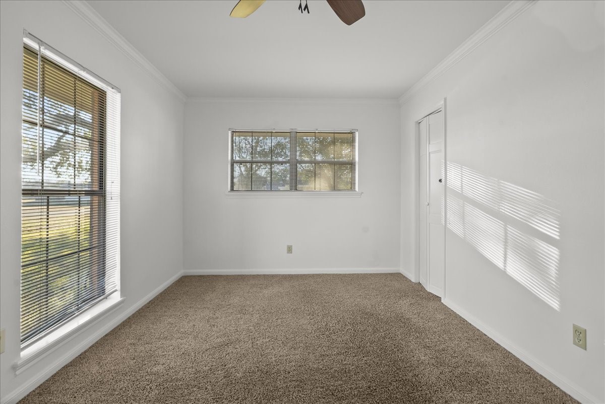 105 Alice Street Anahuac, TX 77514 - Photo 20 of 39 a view of an empty room with a window