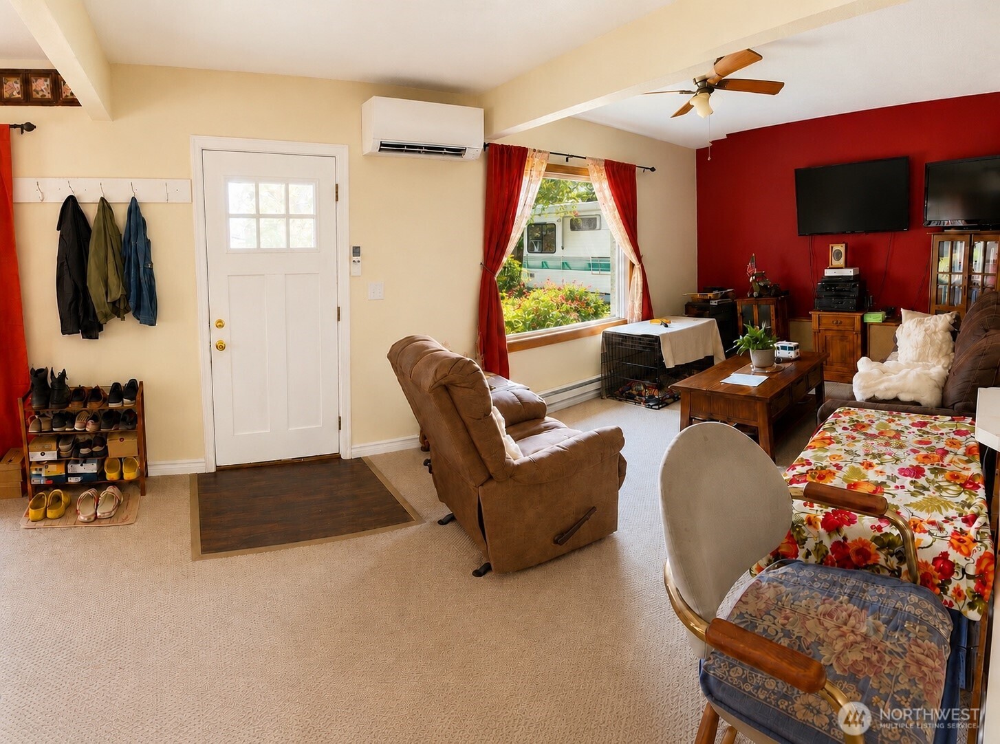 902 Harding Road Aberdeen, WA 98520 - Photo 2 of 18 a living room with furniture a flat screen tv and a large window