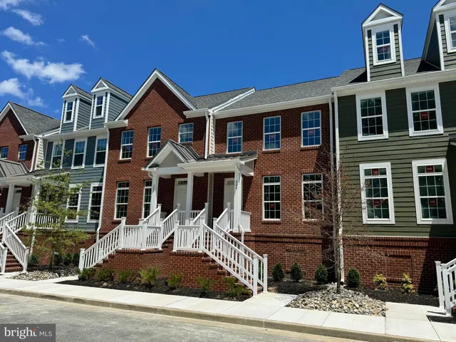 a front view of a house with yard