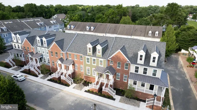 a view of multiple houses with a street