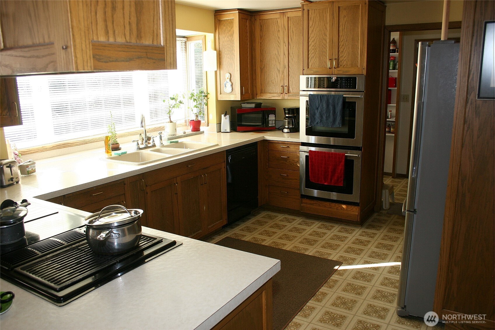 30726 43rd Avenue Southwest Federal Way, WA 98023 - Photo 12 of 39 a kitchen with a sink stove and refrigerator