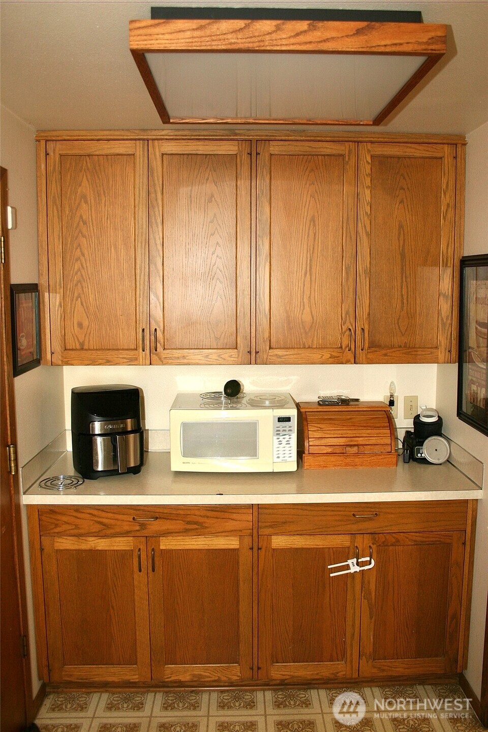 30726 43rd Avenue Southwest Federal Way, WA 98023 - Photo 15 of 39 a kitchen with stainless steel appliances granite countertop a sink stove and cabinets