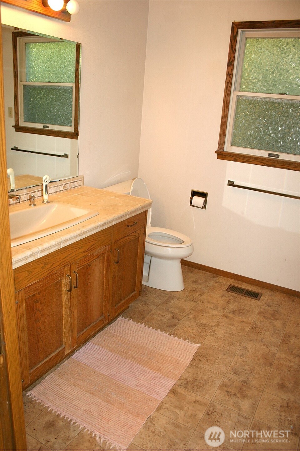 30726 43rd Avenue Southwest Federal Way, WA 98023 - Photo 18 of 39 a bathroom with a toilet sink and mirror