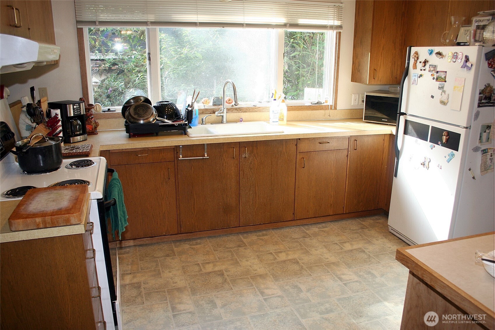 30726 43rd Avenue Southwest Federal Way, WA 98023 - Photo 23 of 39 a view of a kitchen with fridge and workspace