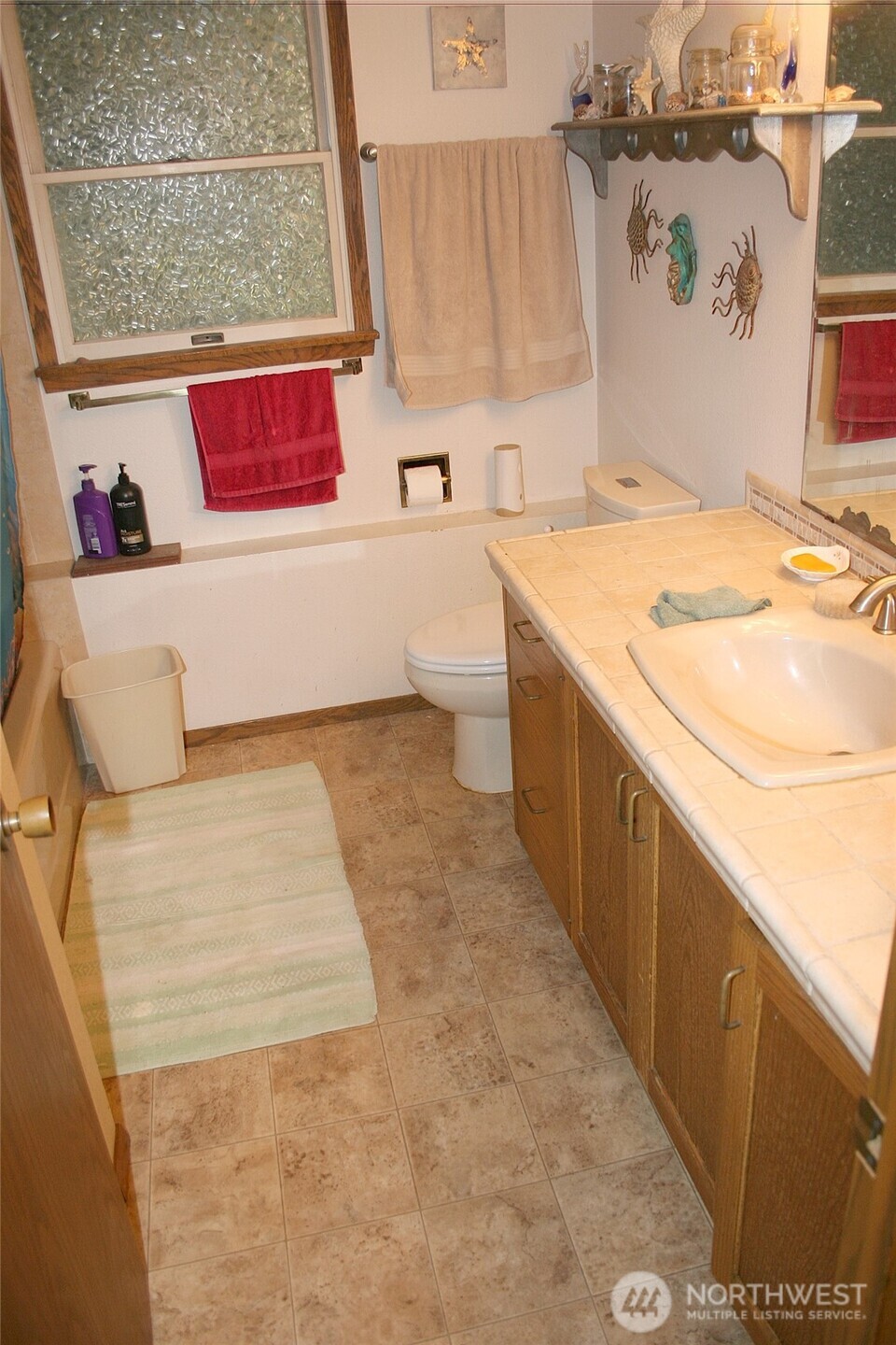 30726 43rd Avenue Southwest Federal Way, WA 98023 - Photo 31 of 39 a bathroom with a sink toilet and shower