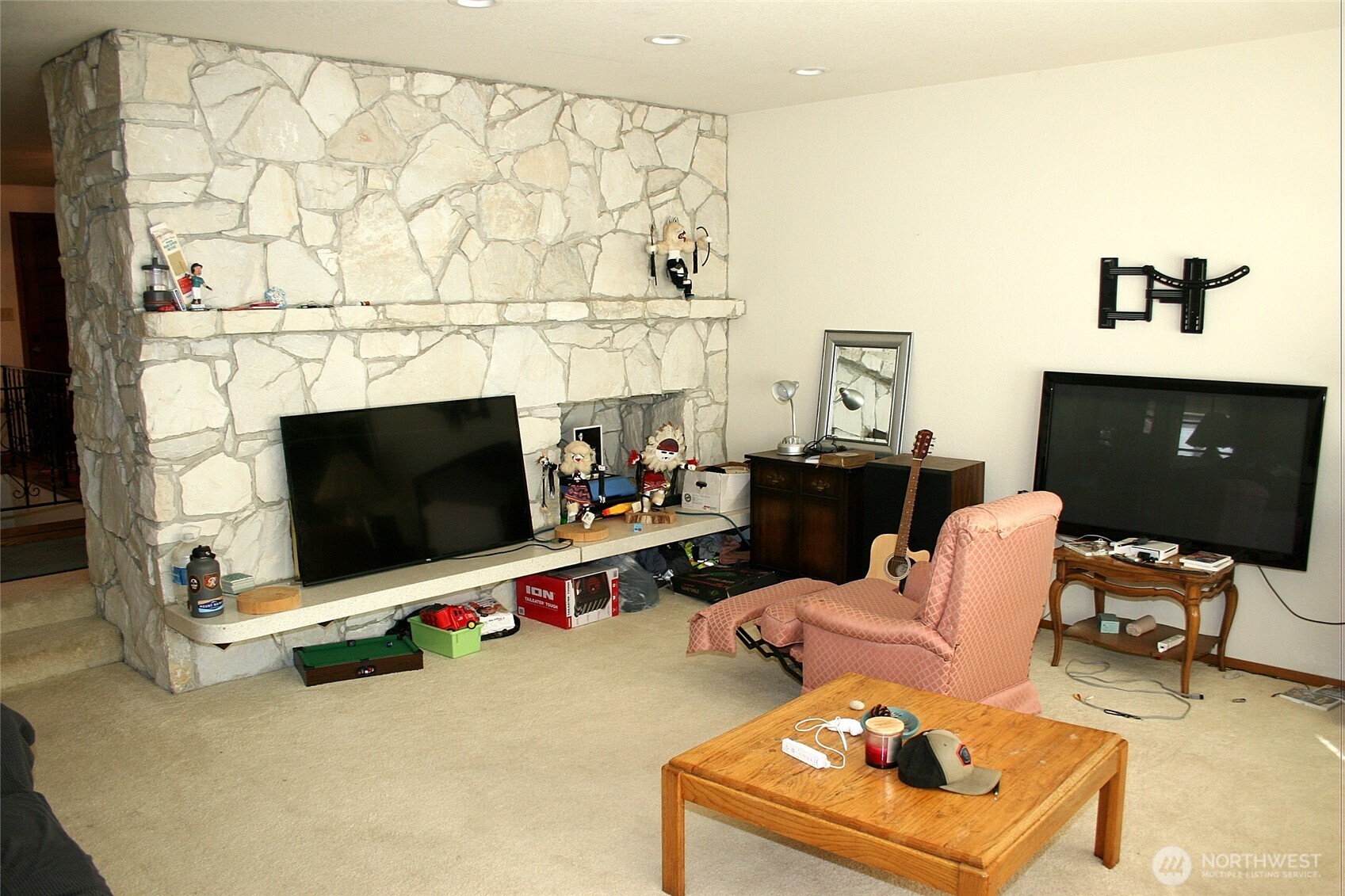 30726 43rd Avenue Southwest Federal Way, WA 98023 - Photo 10 of 39 a living room with furniture a flat screen tv and a fireplace