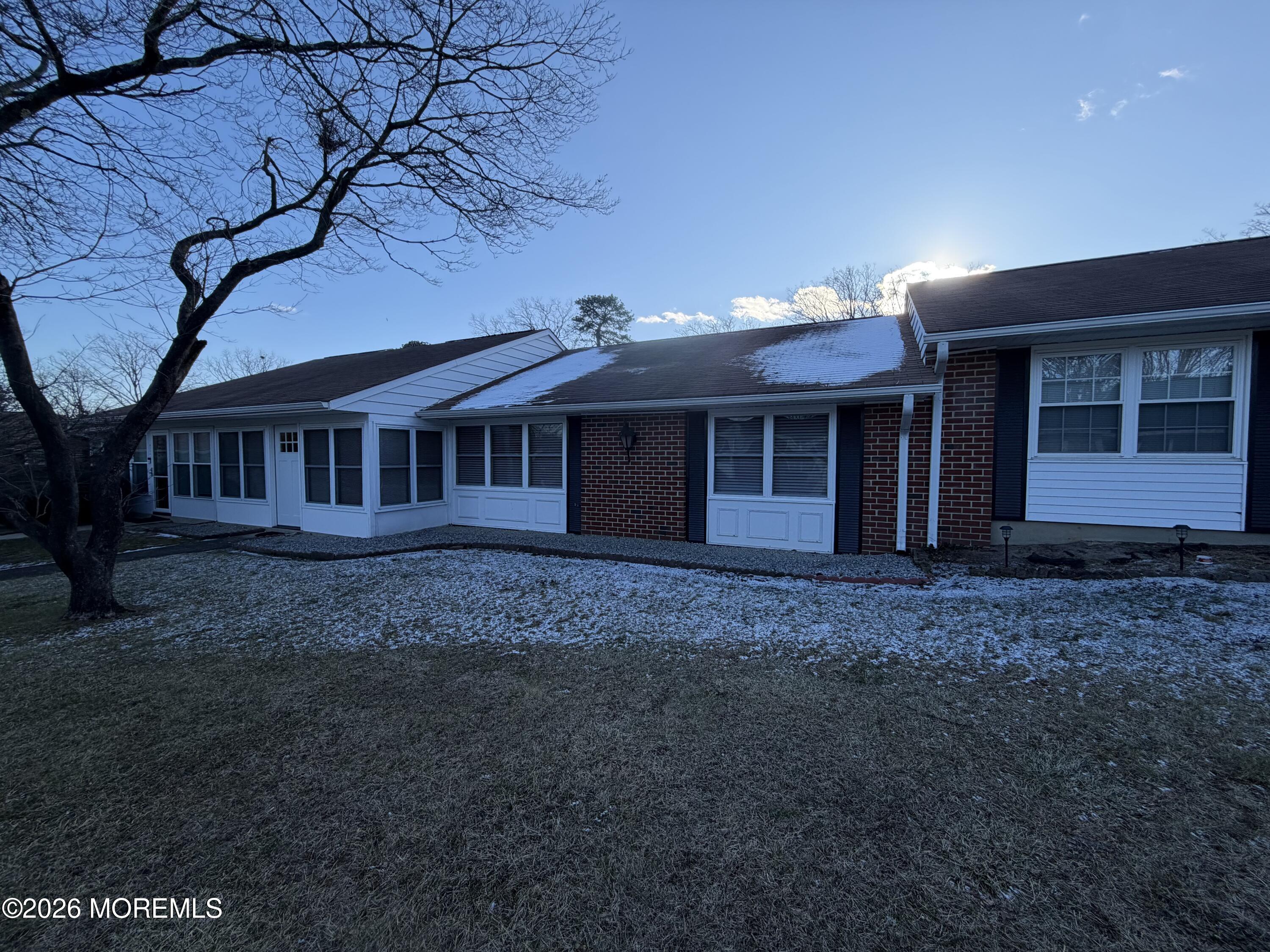 833 B Inverness Court, Unit B Lakewood, NJ 08701 - Photo 19 of 43 a view of a house with a yard