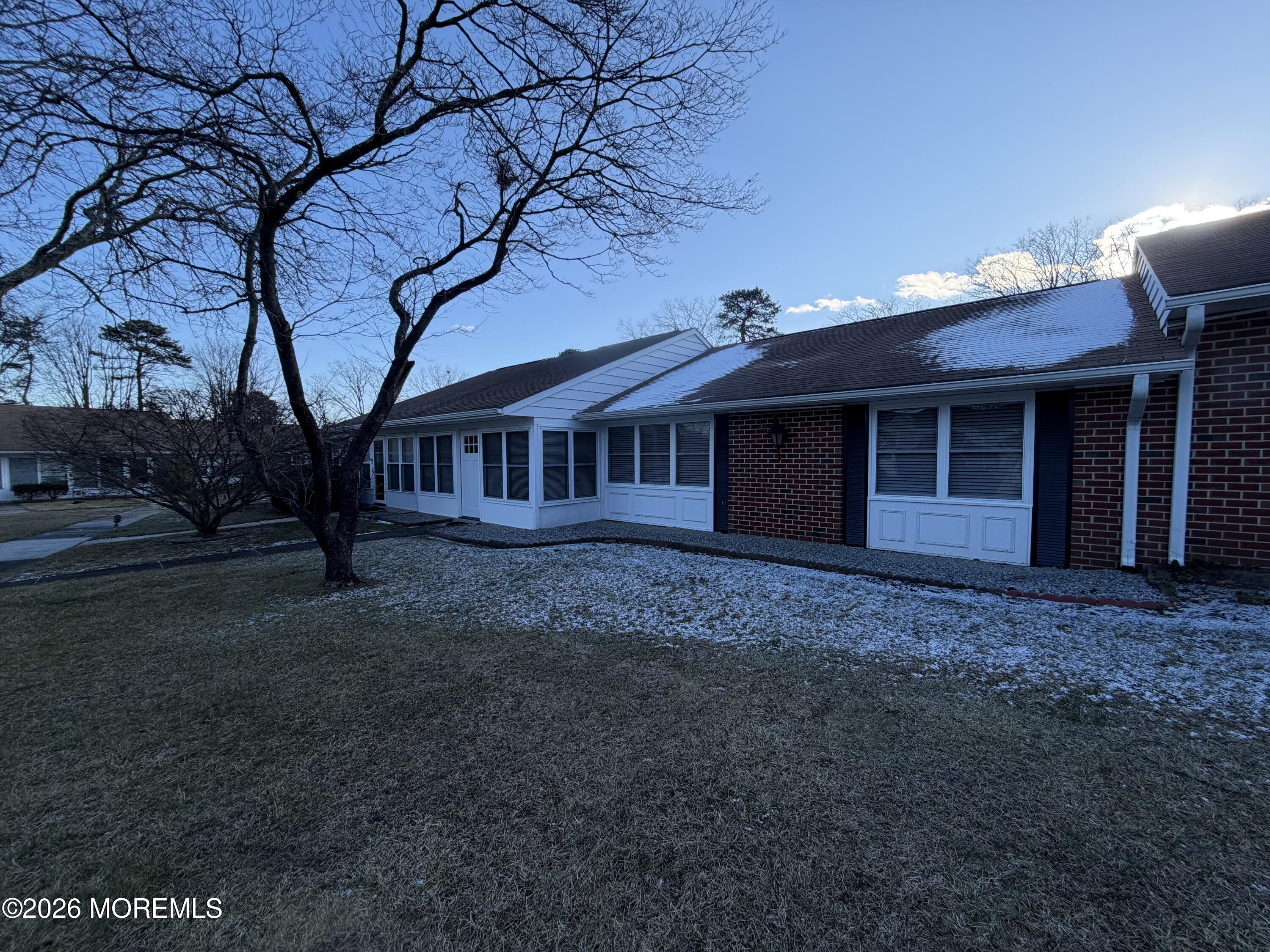 833 B Inverness Court, Unit B Lakewood, NJ 08701 - Photo 20 of 43 a view of a house with a yard