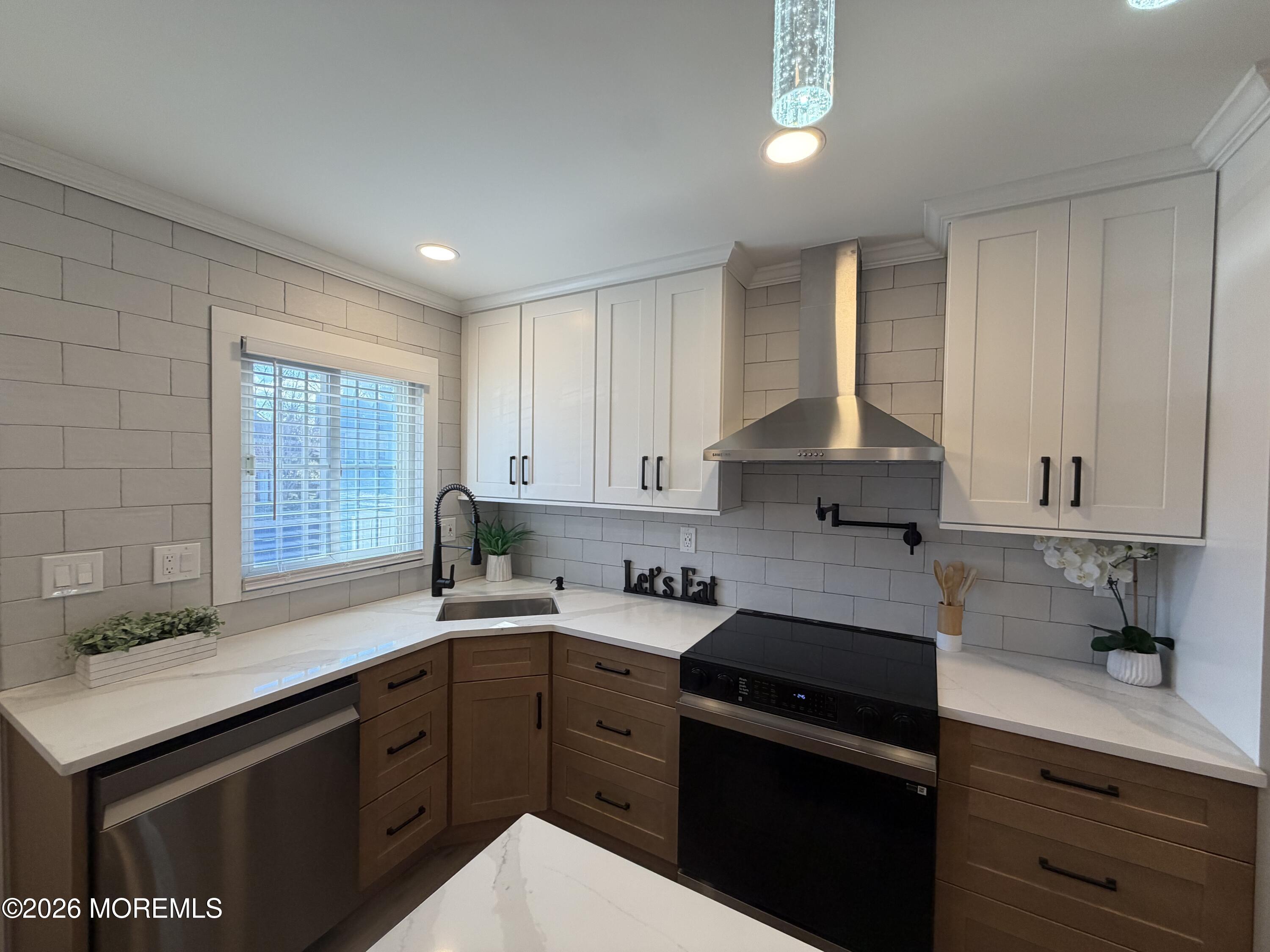 833 B Inverness Court, Unit B Lakewood, NJ 08701 - Photo 2 of 43 a kitchen with a sink stove and cabinets