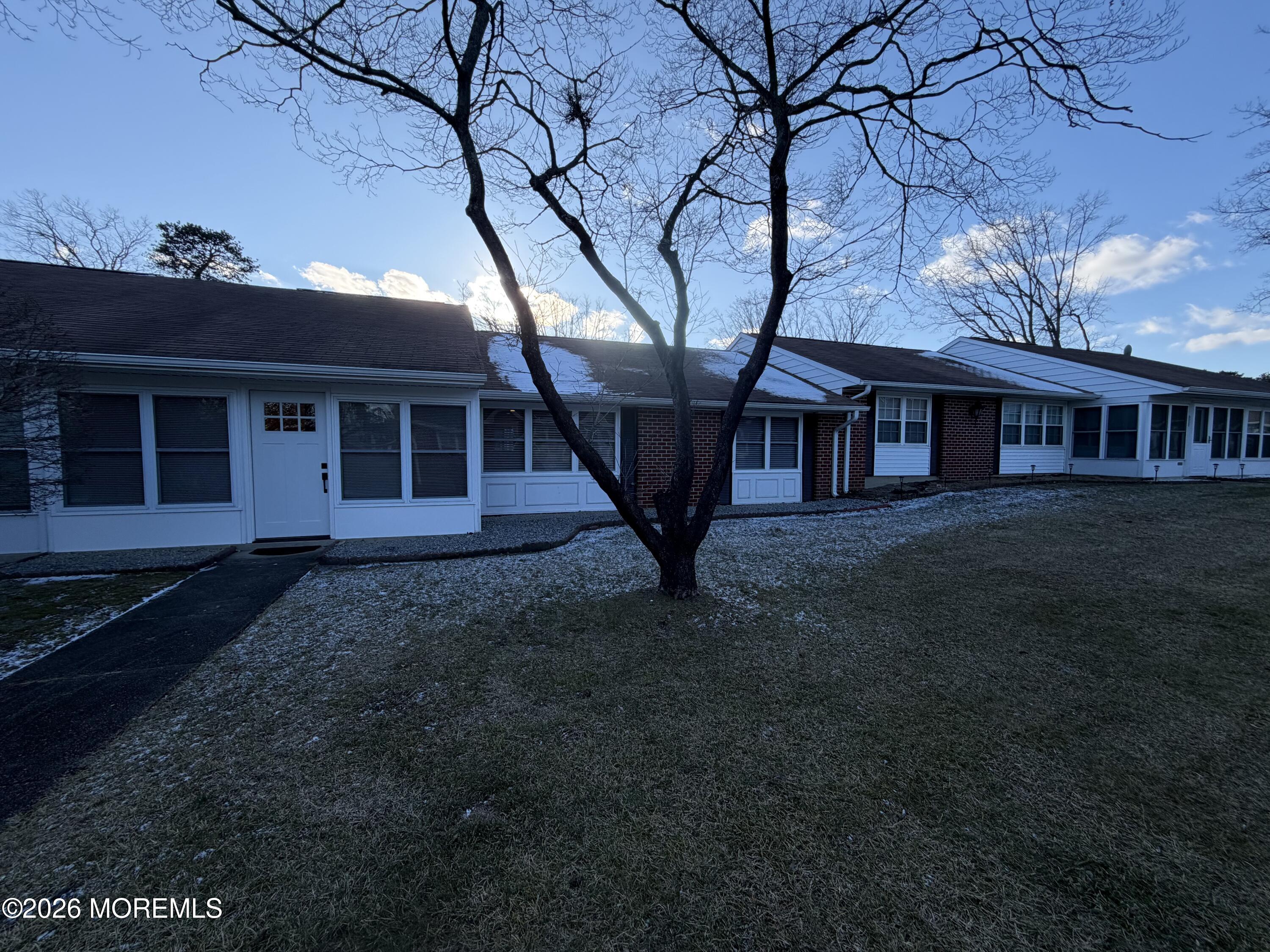 833 B Inverness Court, Unit B Lakewood, NJ 08701 - Photo 21 of 43 a view of a house with a yard
