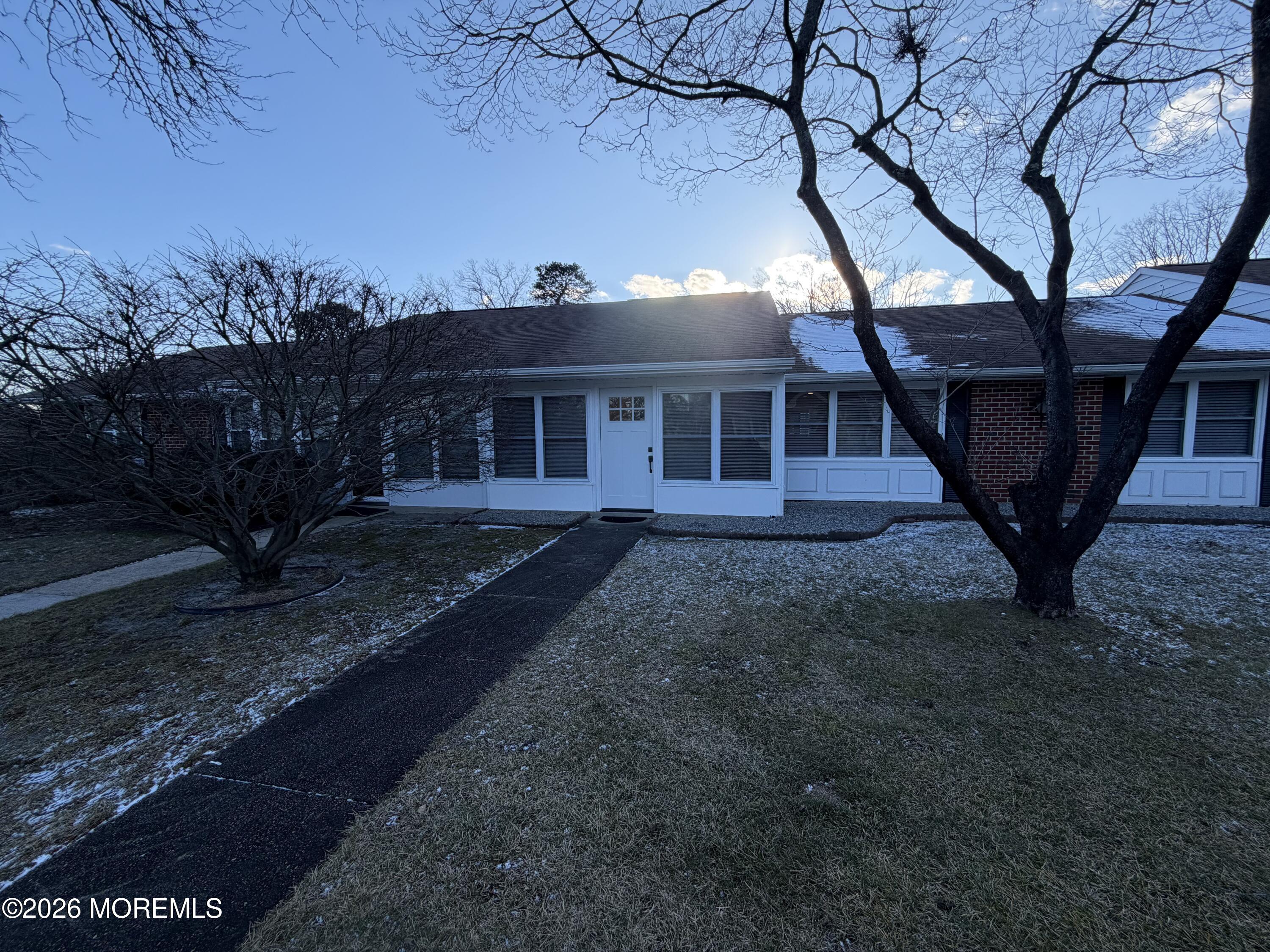 833 B Inverness Court, Unit B Lakewood, NJ 08701 - Photo 22 of 43 a front view of a house with garden