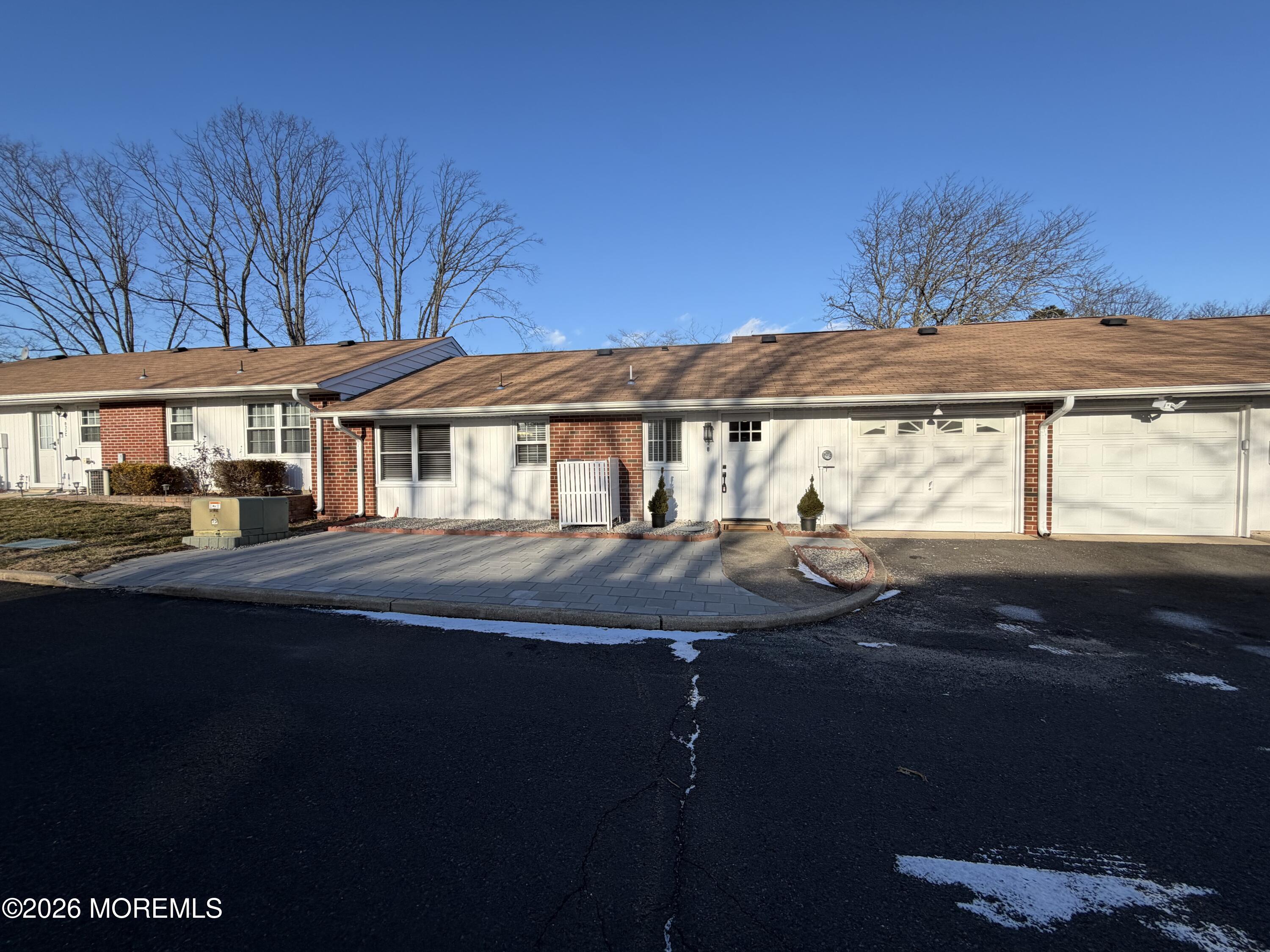 833 B Inverness Court, Unit B Lakewood, NJ 08701 - Photo 27 of 43 a front view of a house with garden