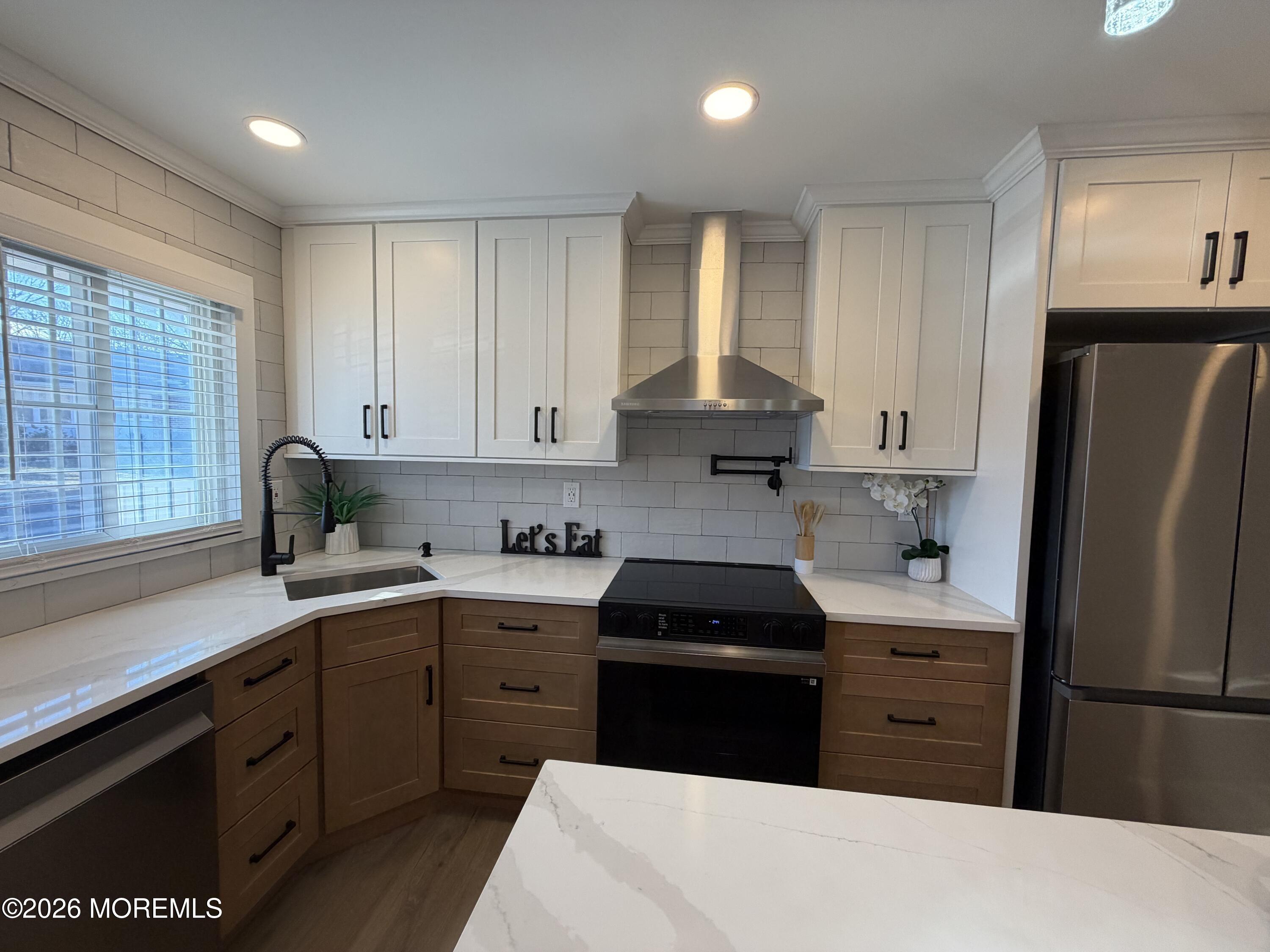 833 B Inverness Court, Unit B Lakewood, NJ 08701 - Photo 3 of 43 a kitchen with a refrigerator stove and sink