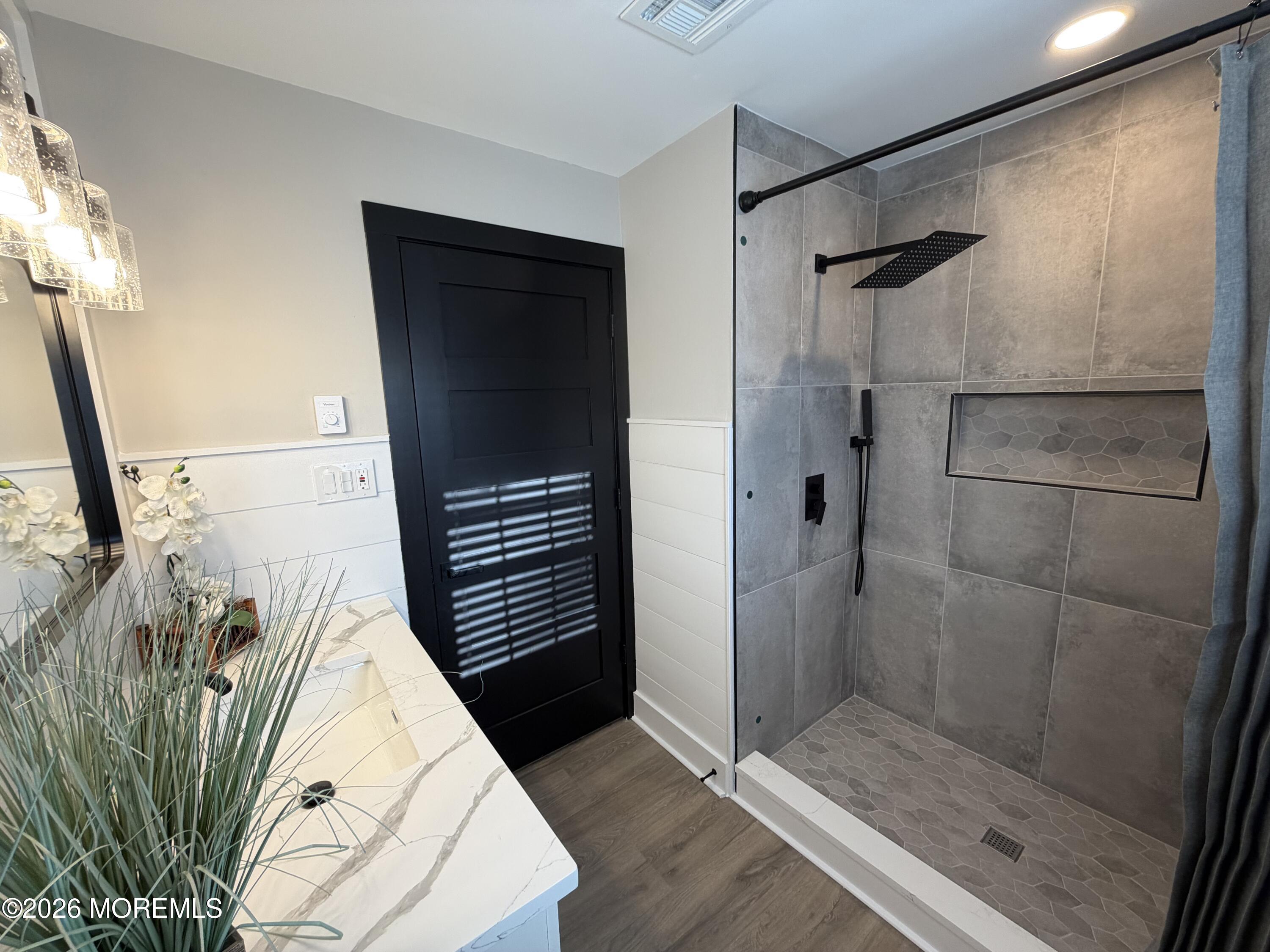 833 B Inverness Court, Unit B Lakewood, NJ 08701 - Photo 34 of 43 a bathroom with a shower and a sink