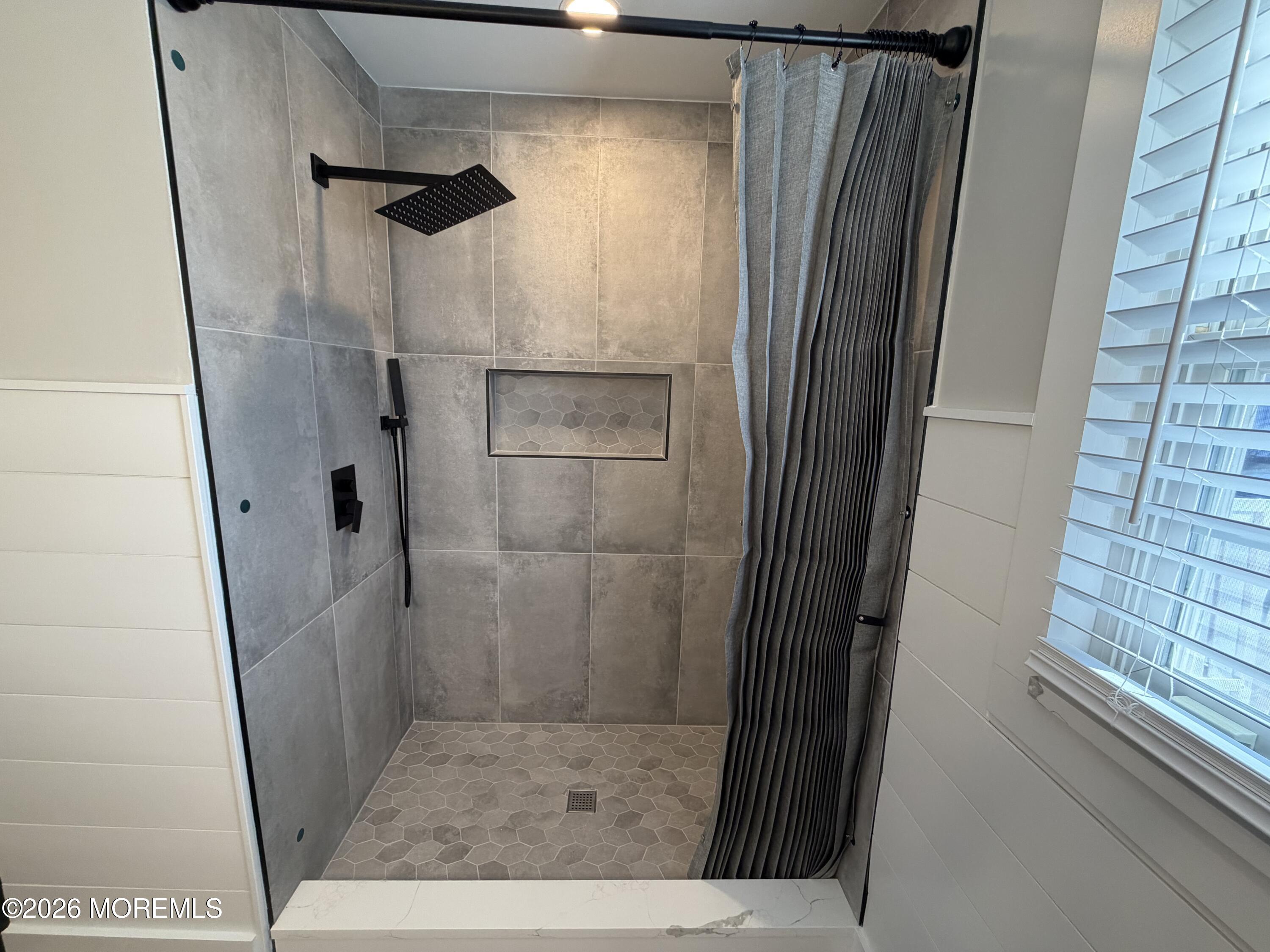 833 B Inverness Court, Unit B Lakewood, NJ 08701 - Photo 35 of 43 a bathroom with a glass door shower and a sink