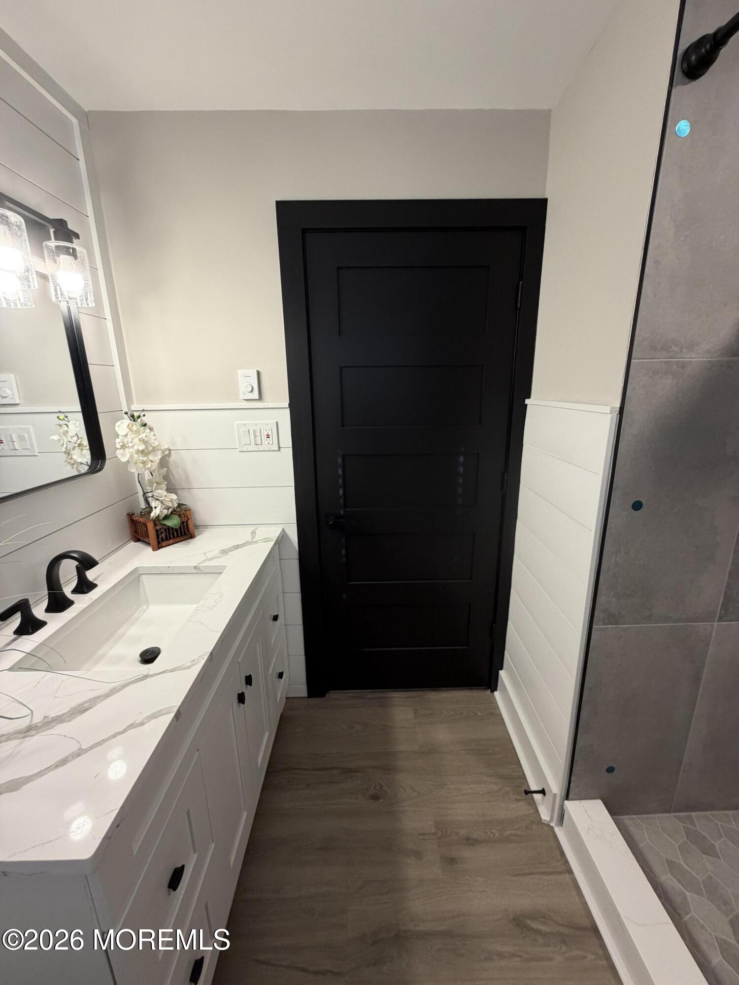 833 B Inverness Court, Unit B Lakewood, NJ 08701 - Photo 39 of 43 a bathroom with a double vanity sink and mirror