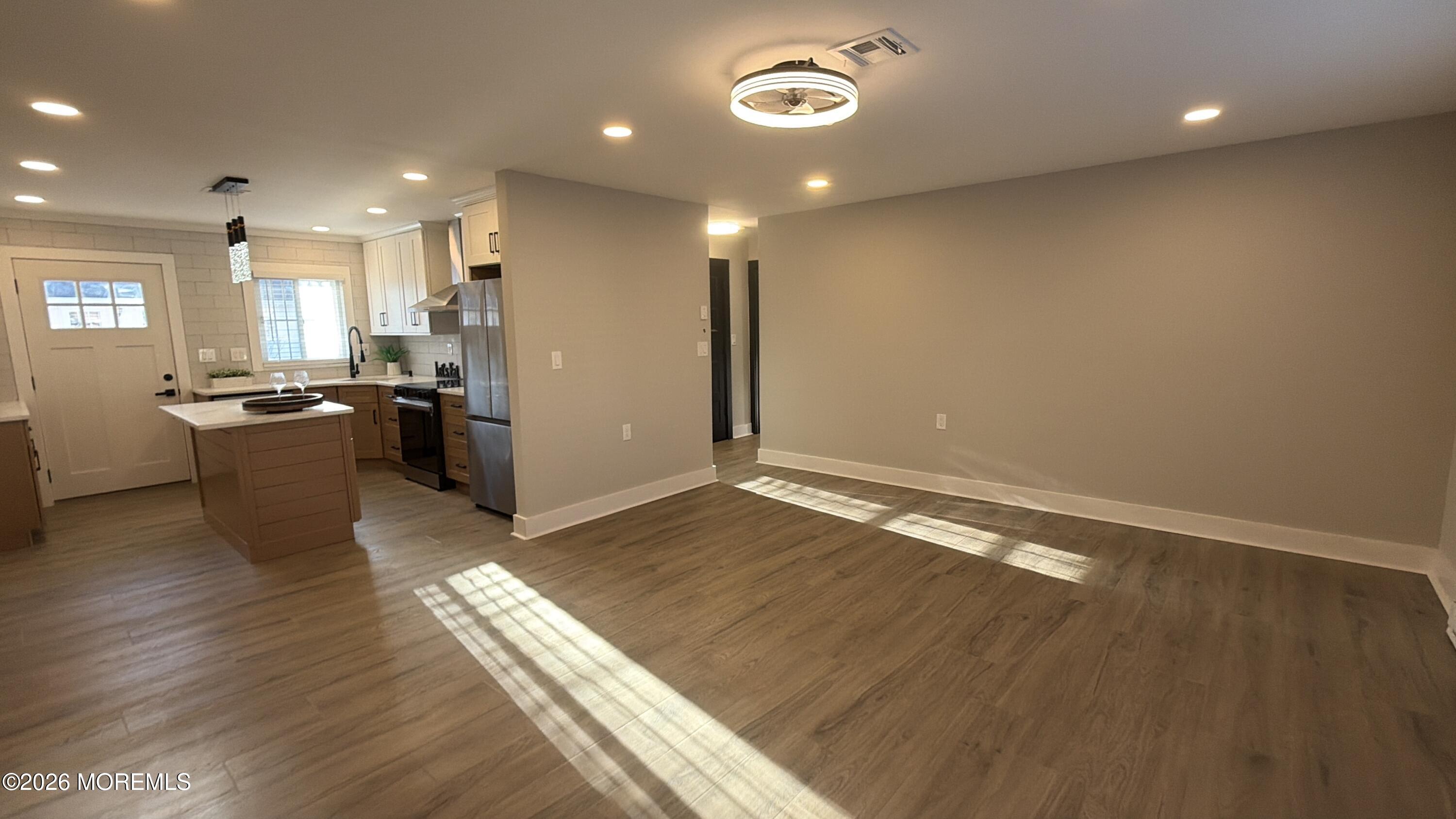 833 B Inverness Court, Unit B Lakewood, NJ 08701 - Photo 4 of 43 a view of a kitchen with a sink and a refrigerator