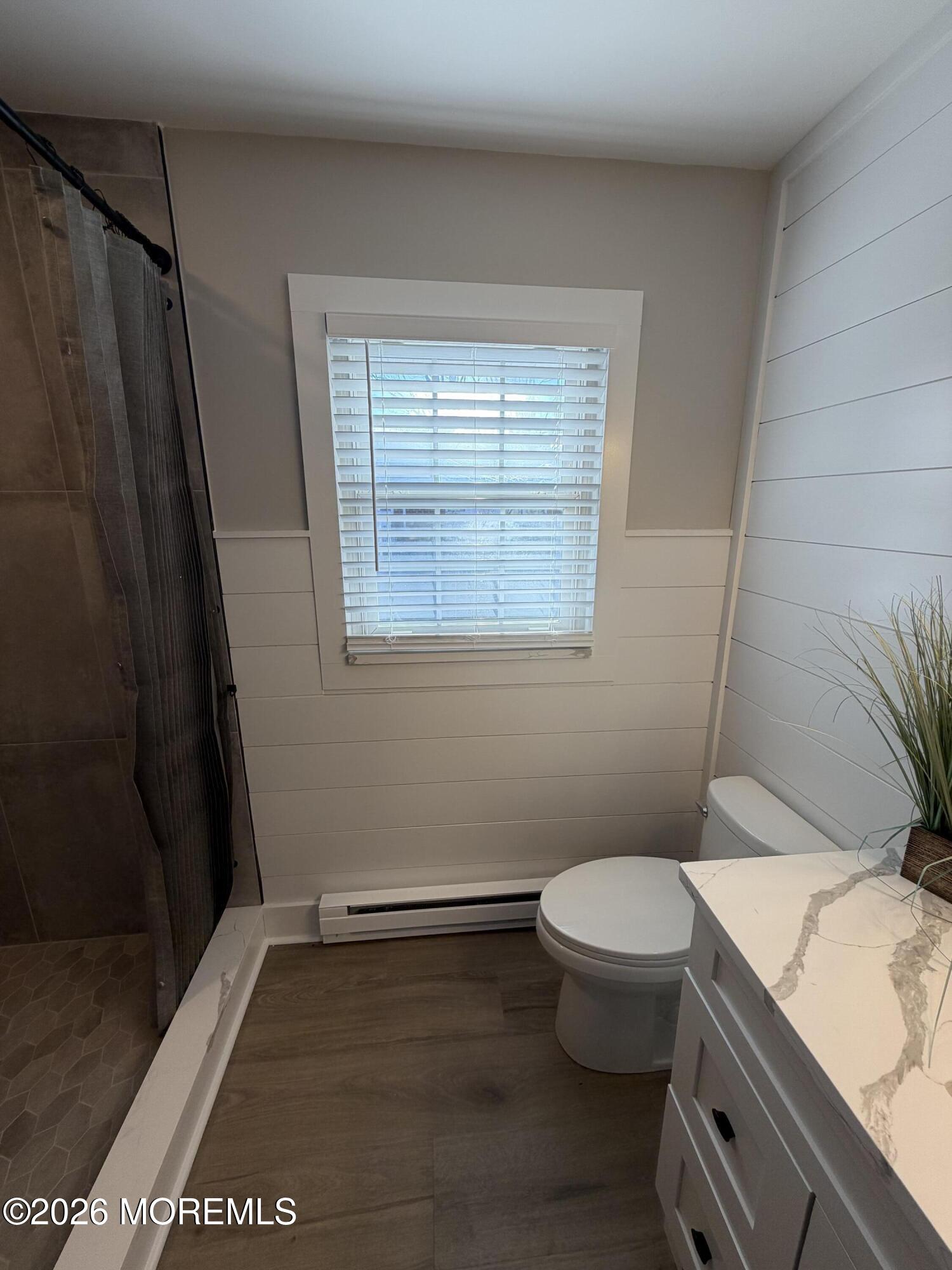 833 B Inverness Court, Unit B Lakewood, NJ 08701 - Photo 41 of 43 a bathroom with a granite countertop toilet and a sink