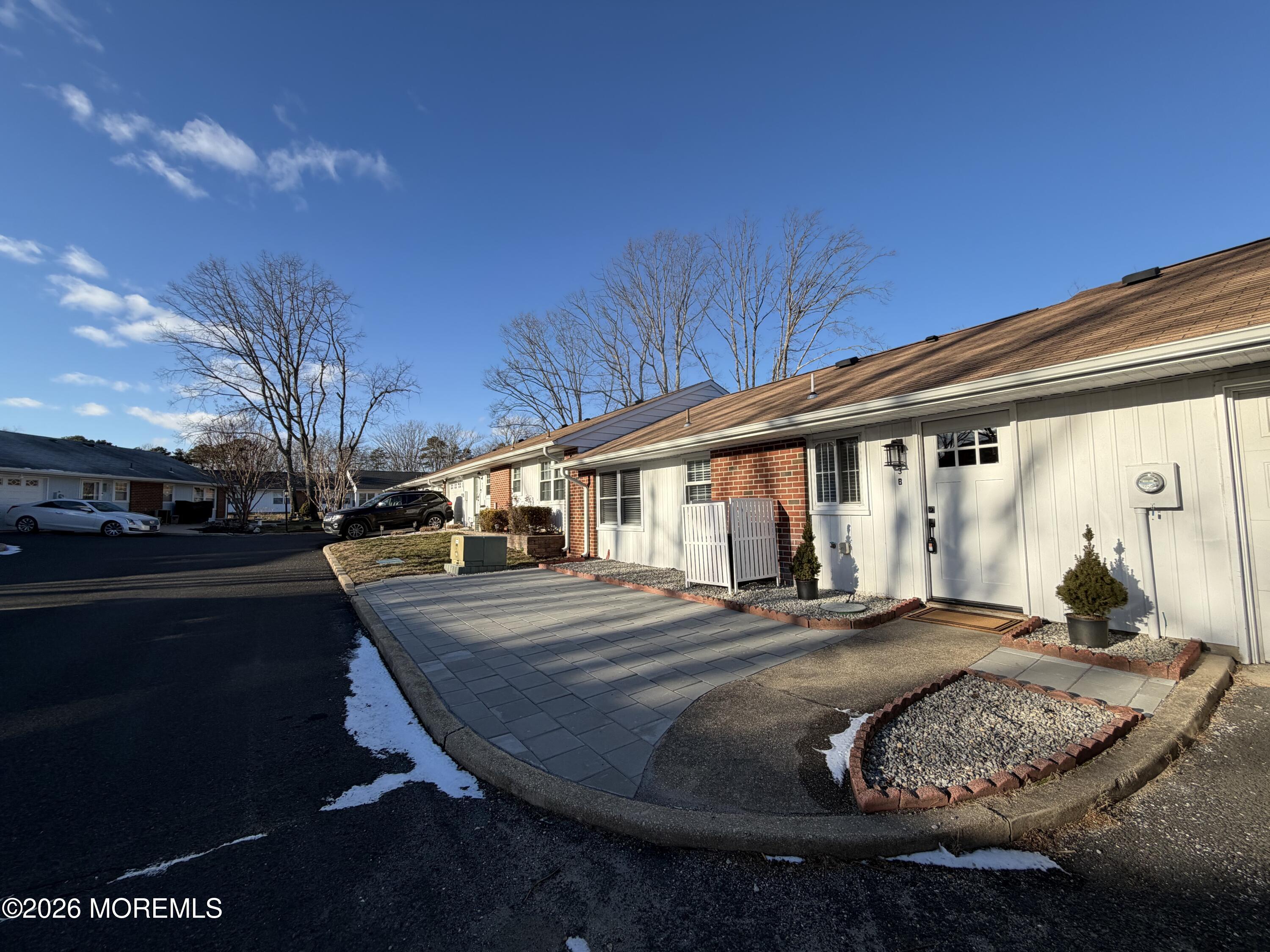 833 B Inverness Court, Unit B Lakewood, NJ 08701 - Photo 6 of 43 a front view of a house with garden