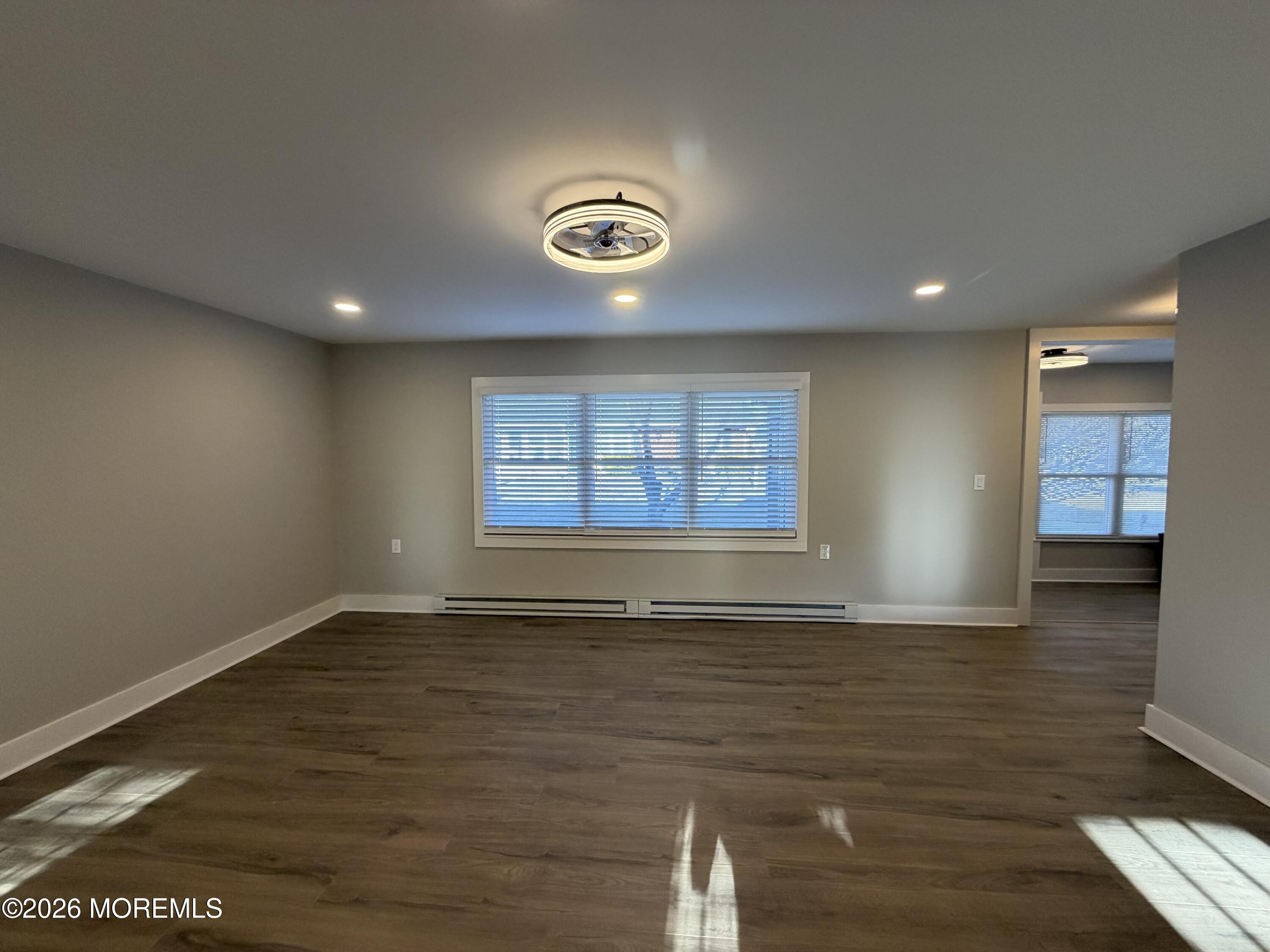 833 B Inverness Court, Unit B Lakewood, NJ 08701 - Photo 10 of 43 a view of an empty room with a window