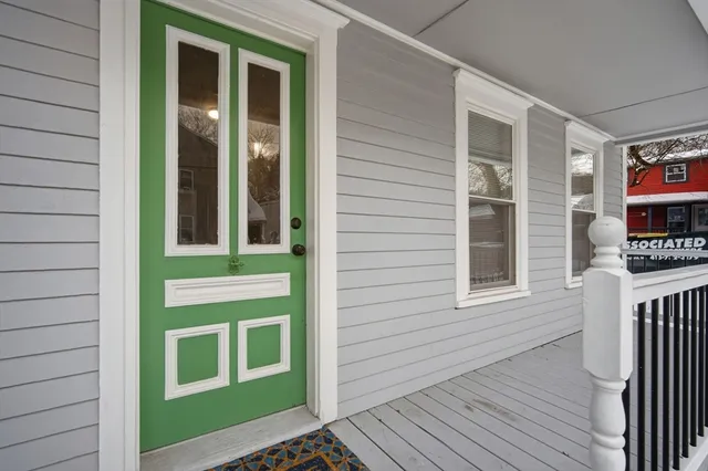 a view of a brick house with many windows