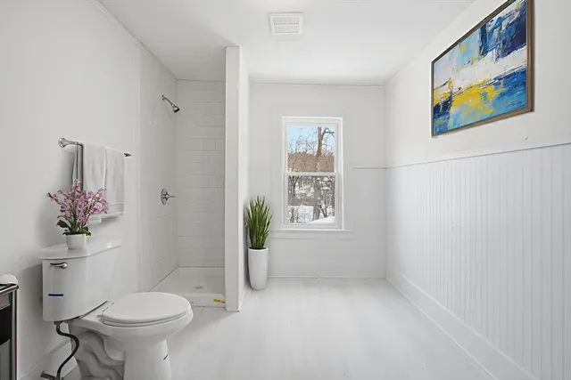 a bathroom with a toilet sink and tub