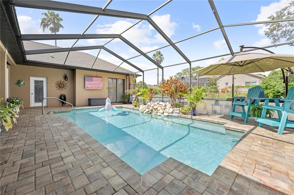 14173 Pullman Drive Spring Hill, FL 34609 - Photo 11 of 77 a view of a swimming pool with a patio