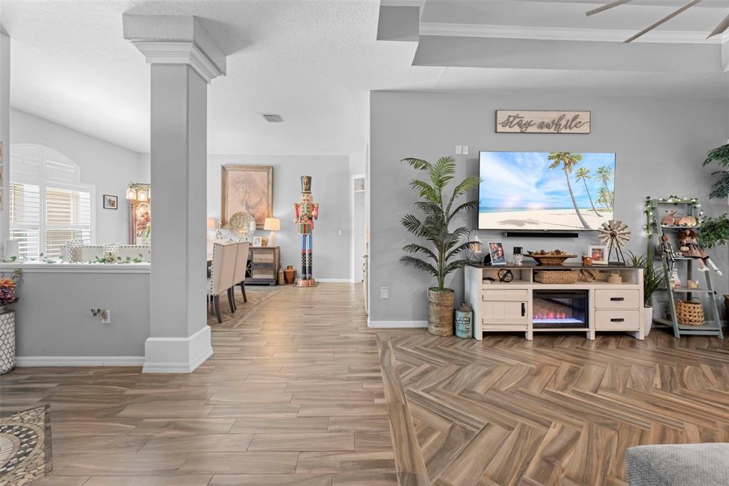 14173 Pullman Drive Spring Hill, FL 34609 - Photo 23 of 77 a living room with furniture and a flat screen tv