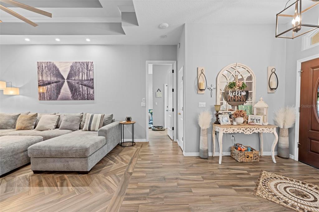 14173 Pullman Drive Spring Hill, FL 34609 - Photo 34 of 77 a living room with furniture and wooden floor