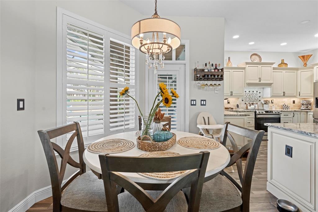 14173 Pullman Drive Spring Hill, FL 34609 - Photo 42 of 77 a dining room with furniture and window