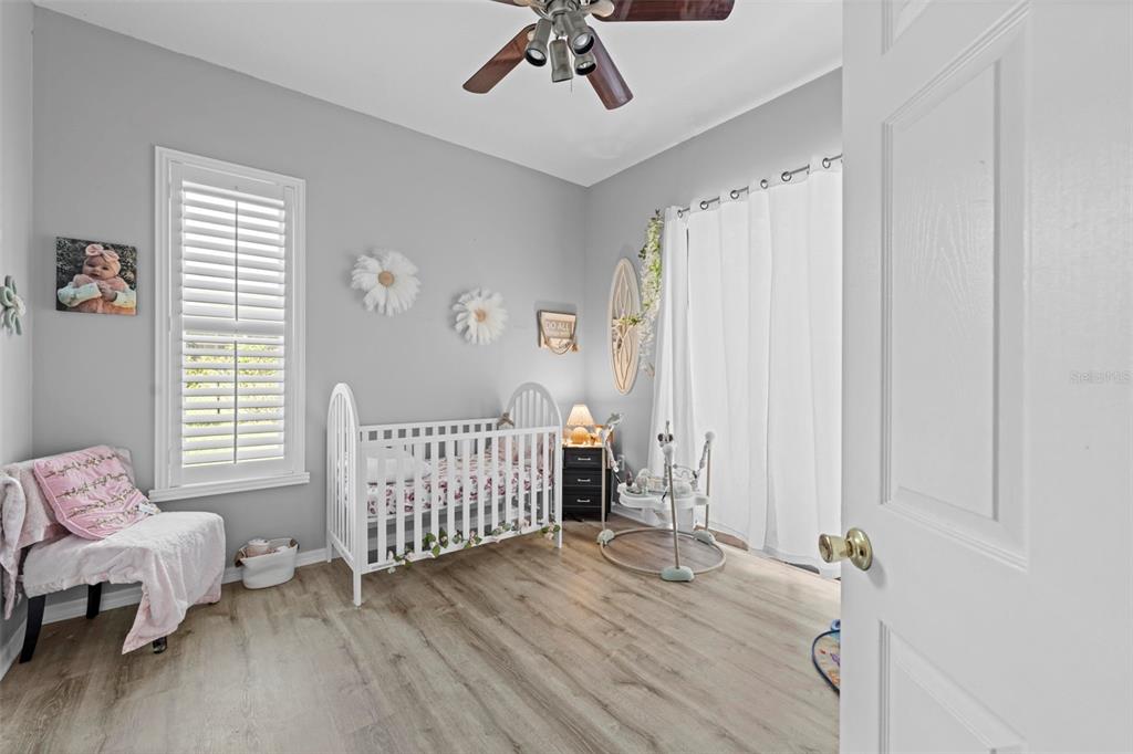 14173 Pullman Drive Spring Hill, FL 34609 - Photo 56 of 77 a bedroom with furniture and windows