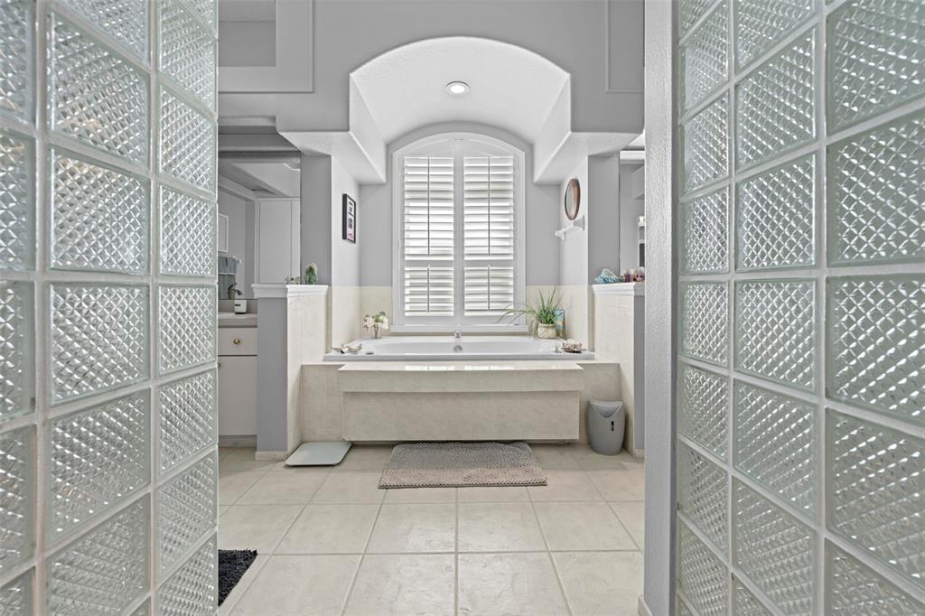 14173 Pullman Drive Spring Hill, FL 34609 - Photo 69 of 77 a bathroom with a bathtub and a shower